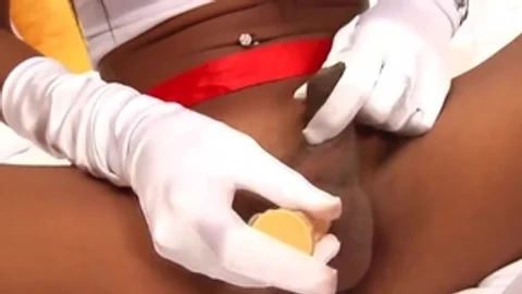 Tanned Ladyboy Nurse Teases With Her large boobs And long schlong